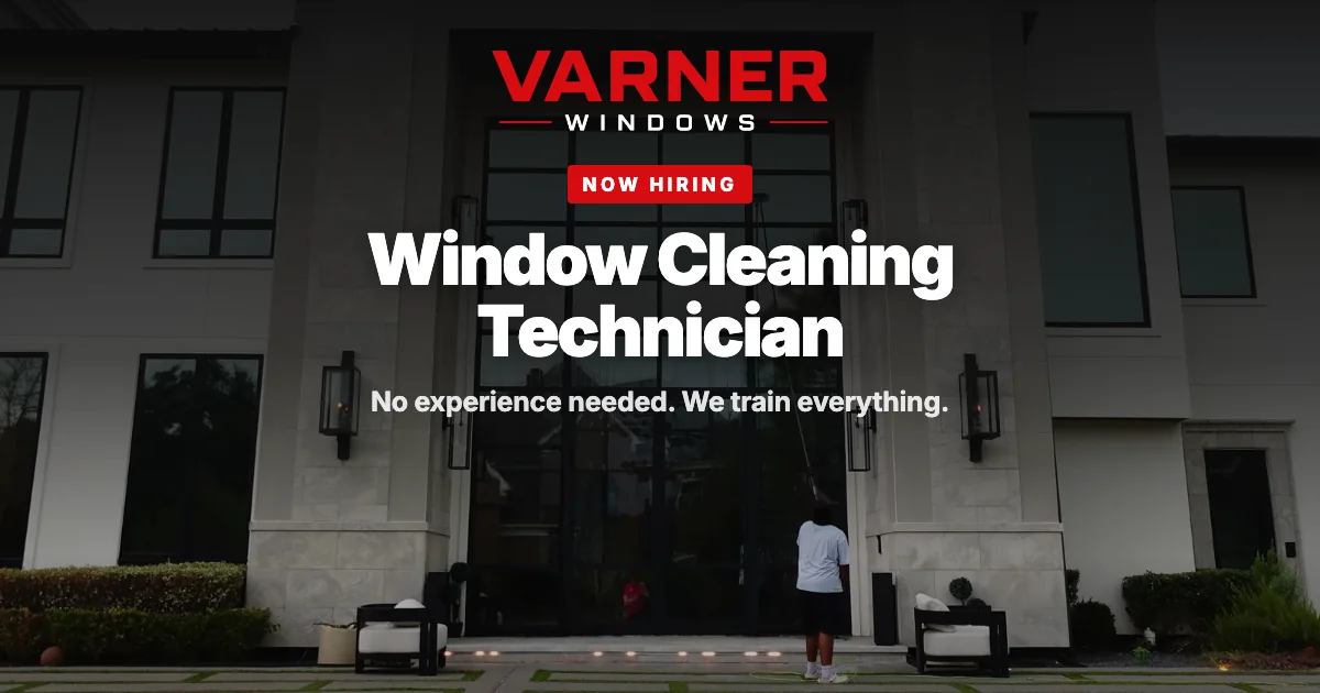 Now hiring: Window Cleaning Technician. A Varner technician cleaning a two-storey glass entry from the ground with a water-fed pole.